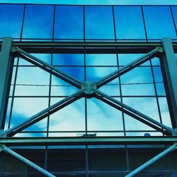 Low angle view of bridge against blue sky