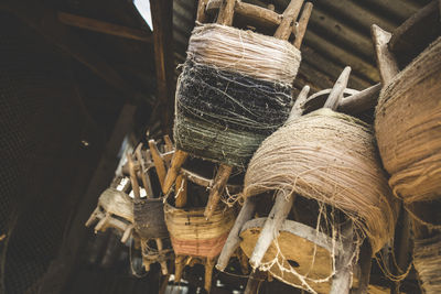 Close-up of weathered wooden spools