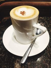 Close-up of cappuccino on table