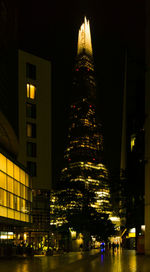 Low angle view of illuminated buildings at night