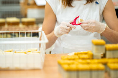 Midsection of woman holding food