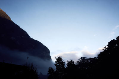 Low angle view of silhouette mountain against sky