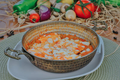 Close-up of fruits in basket on table