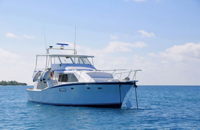 Boat in sea against sky