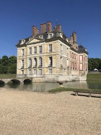 Low angle view of building against clear blue sky