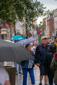 People walking on street in city