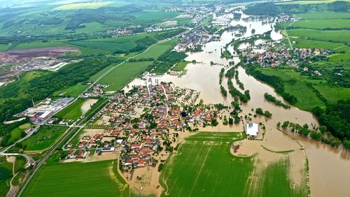 High angle view of river and houses in town