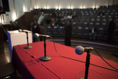 Close-up of microphones on stage