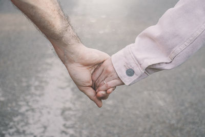 Close-up of man holding hands