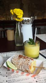 Close-up of fresh orange juice in plate on table