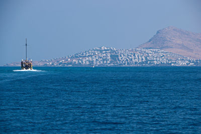 Scenic view of sea against clear blue sky