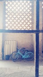 Bicycle parked against wall