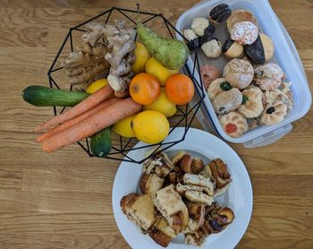 High angle view of fruits and treats on table