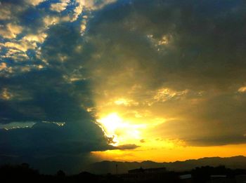 Scenic view of dramatic sky during sunset