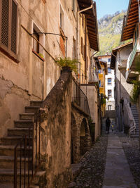 Alley amidst buildings in city