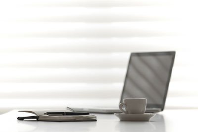 Close-up of coffee cup on table