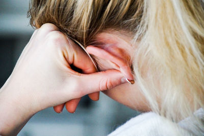 Close-up of young woman at home