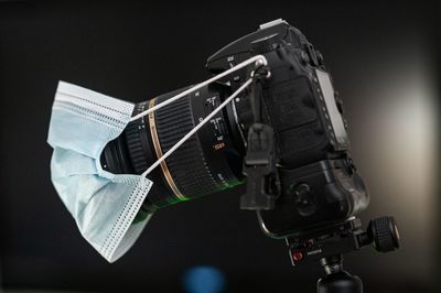 Close-up of camera over black background
