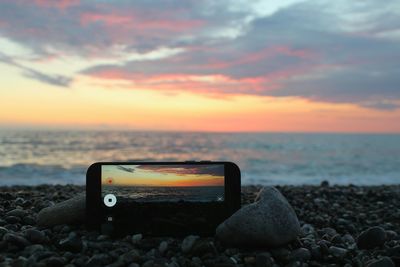 Scenic view of sea against sky during sunset