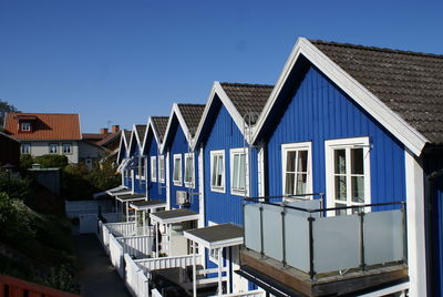 Residential buildings against blue sky