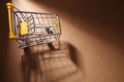 High angle view of tiny shopping cart on table