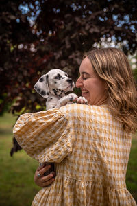 Rear view of woman with dog