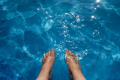 Low section of woman in swimming pool