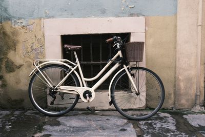 Bicycle parked against wall