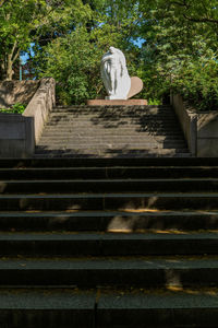 Low angle view of angel statue on staircase