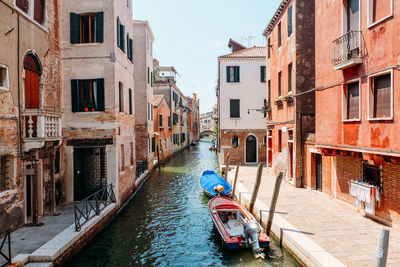 Canal passing through city buildings