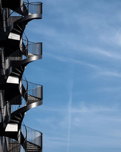 Low angle view of spiral staircase against sky