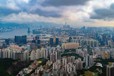 High angle view of modern buildings in city against sky