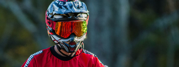 Close-up view of motorcycle rider helmet and reflecting or mirrored googles