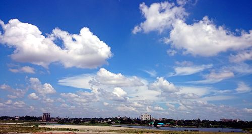 Scenic view of landscape against cloudy sky