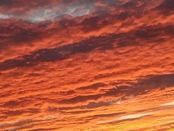 Low angle view of dramatic sky during sunset