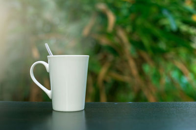 Close-up of coffee cup on table