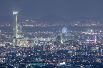 Illuminated buildings in city at night