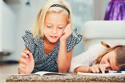 Portrait of mother and daughter at home