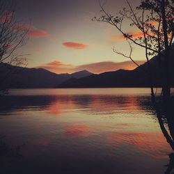 Scenic view of lake at sunset