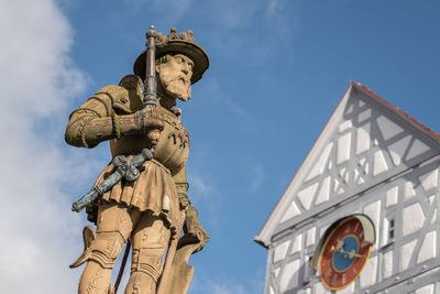 Low angle view of statue  maximilian ii against building against sky