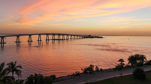 Scenic view of sea against orange sky