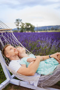 Low section of woman relaxing on grass