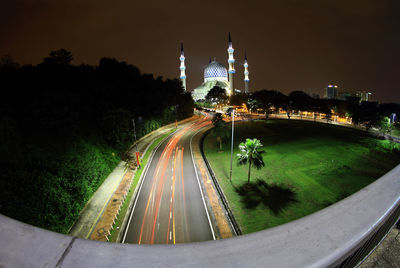 Panoramic view of road at night
