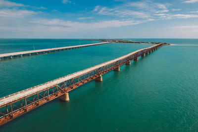 Pier over sea against sky