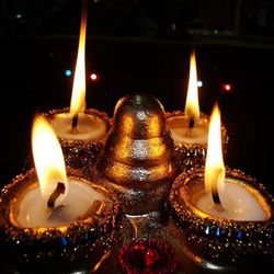 Close-up of lit tea light candle