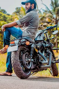 Full length of man sitting on motorcycle