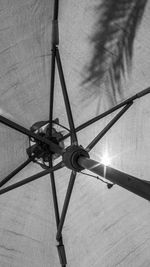 Low angle view of metal against sky