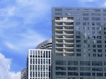 Low angle view of modern buildings against sky