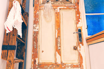 Low angle view of old weathered door