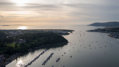 High angle view of beach against sky during sunset